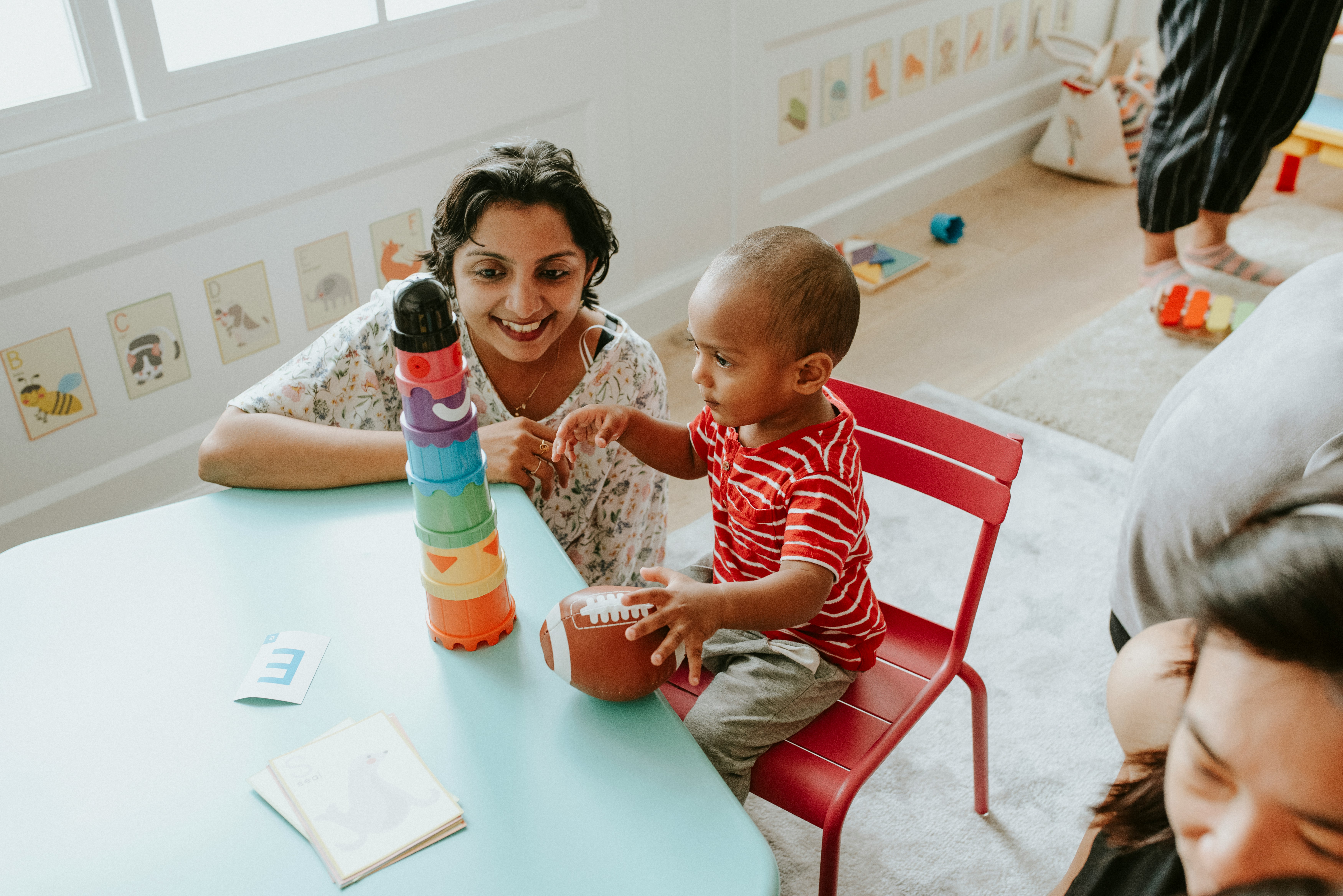 Teacher and child playing together
