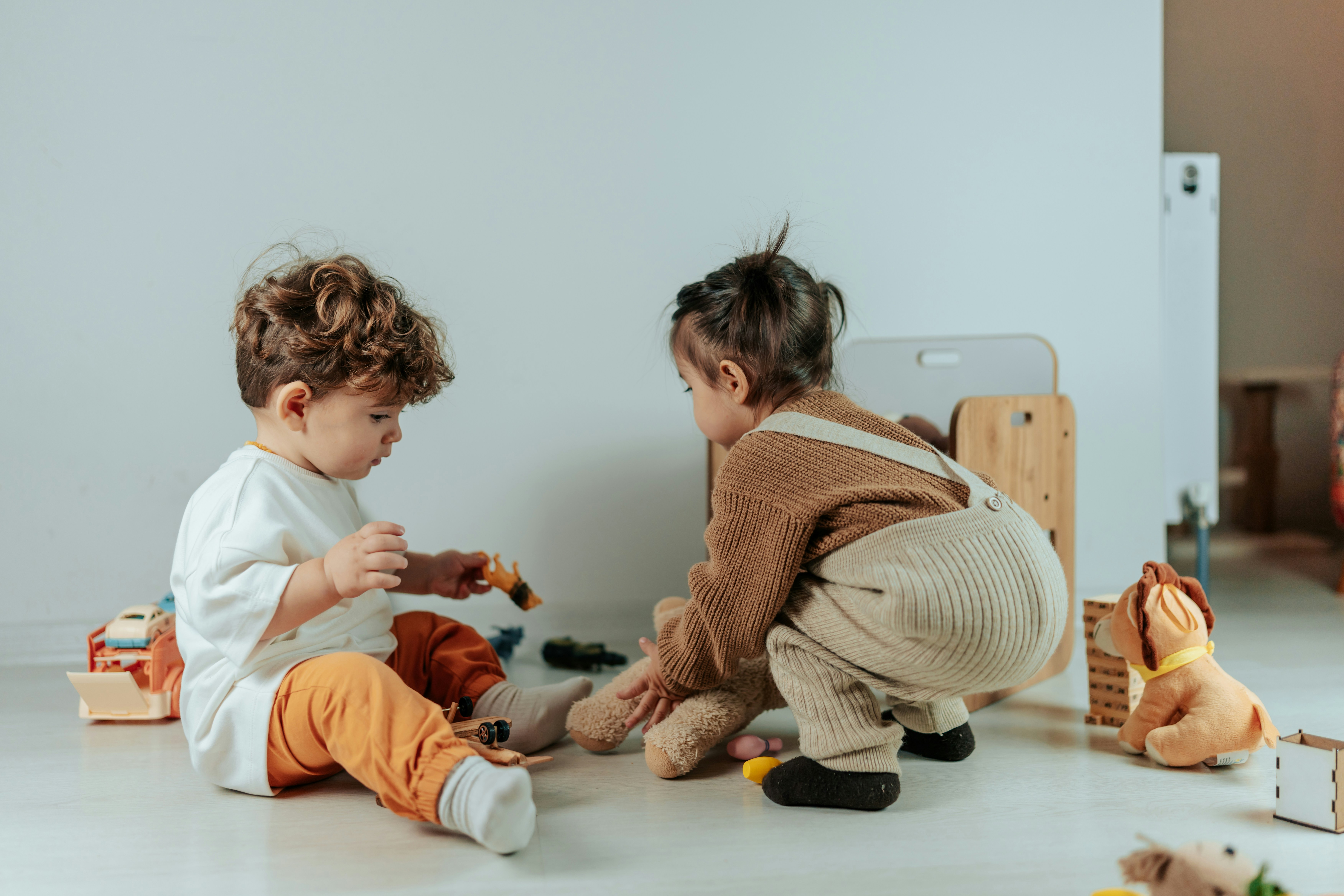 Children playing with toys on the floor